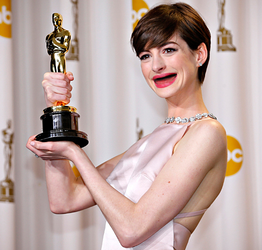 Anne Hathaway holds her Oscar for winning Best Supporting Actress for her role in "Les Miserables" in Hollywood